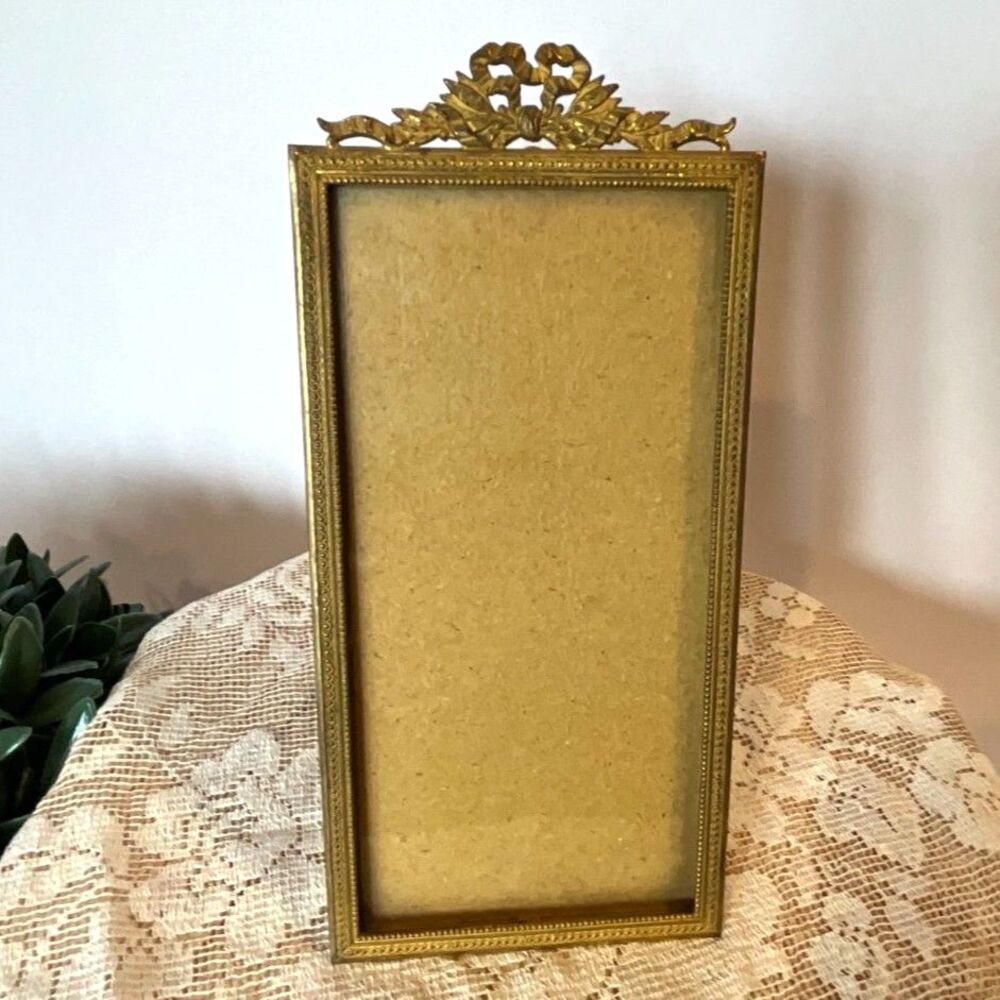Stunning antique French ormolu gilt bronze rectangular bow top frame easel back